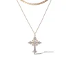 3884-layered-gold-tone-cross-pendant-necklace-1.webp Layered Gold-Tone Cross Pendant Necklace