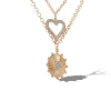 3918-layered-heart-sunburst-pendant-necklace-set-2.webp Layered Heart & Sunburst Pendant Necklace Set